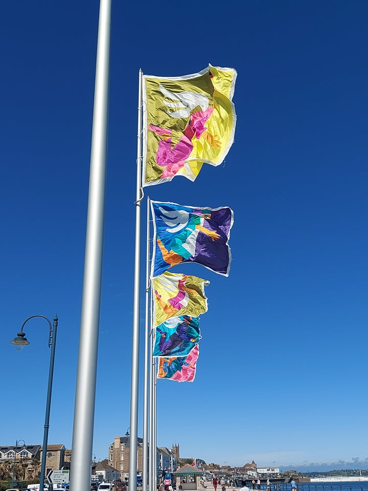 Penzance Promenade Banners 2021 flying in the wind